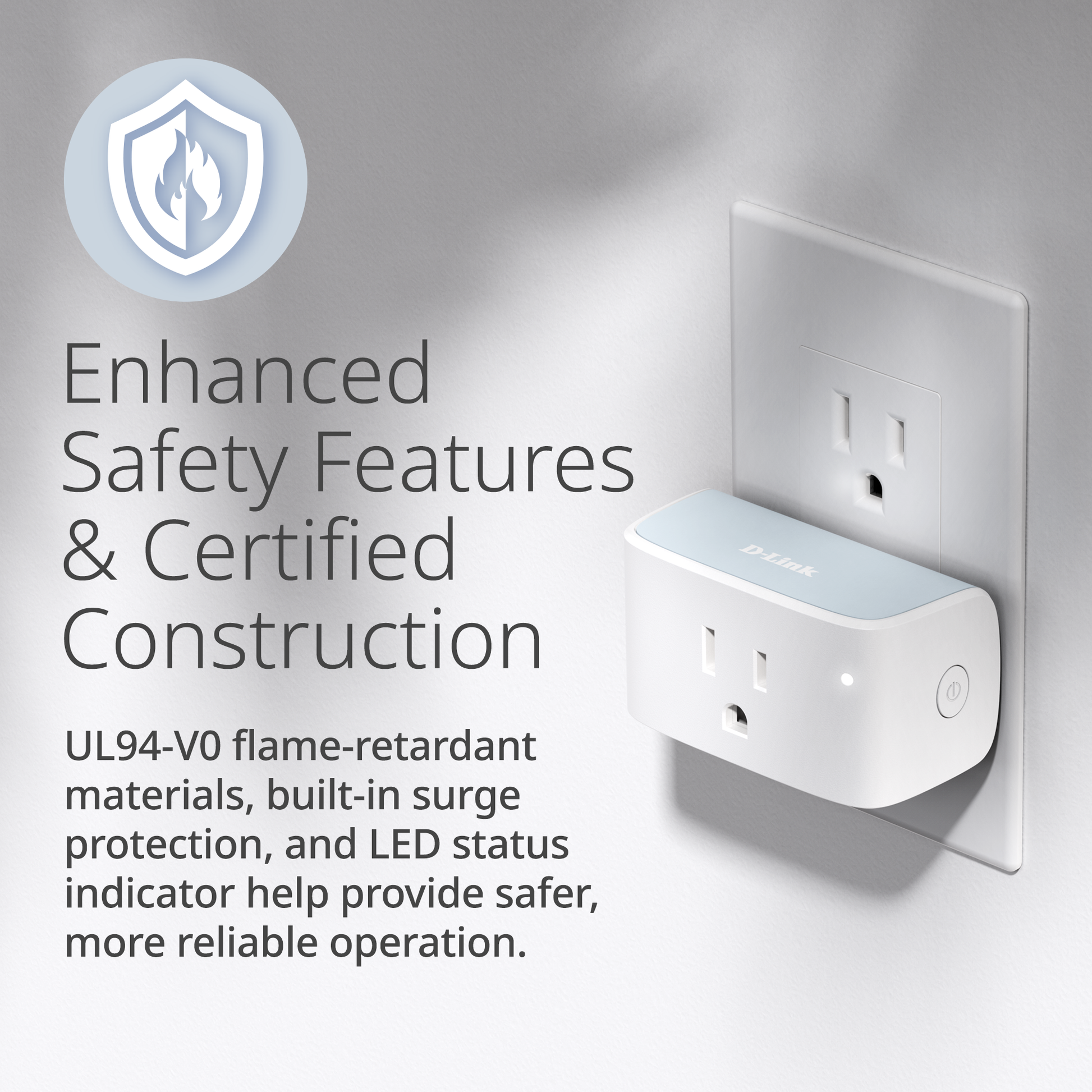 White electrical outlet with safety features text on a gray background